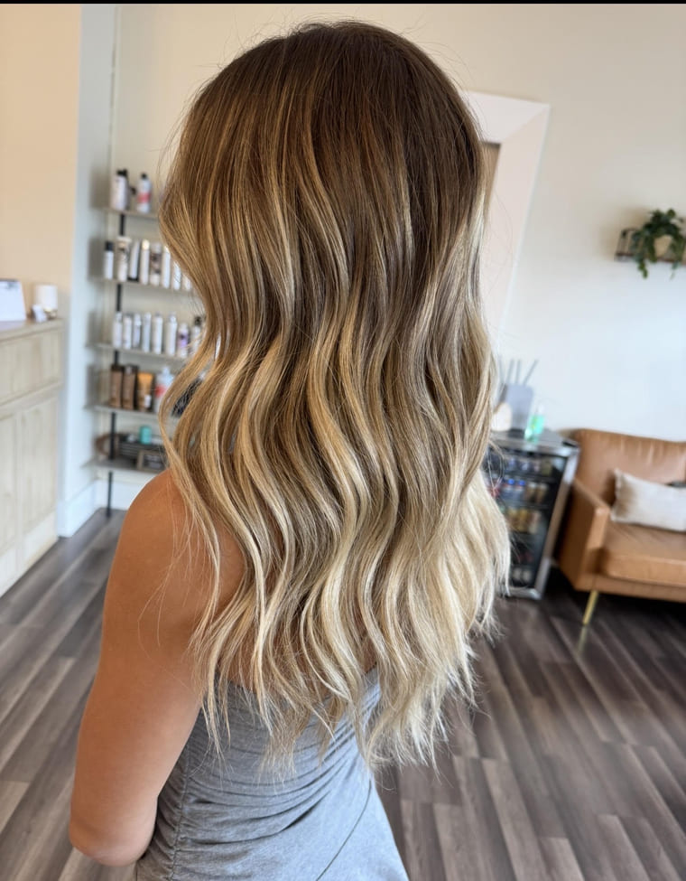 Long blonde balayage with a lived-in shadow root, colored by Lauren